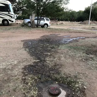 Septic overflowing at the parking spot next to us