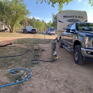 Neighbors dump tube, water and electric in my 'yard area'