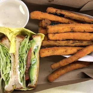 Avocado sandwich and small zucchini&apos;s
