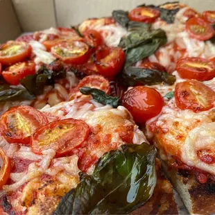 Golden Edge Pizza- San Francisco  Deep dish pan pizza with fresh tomato/ basil. Simple toppings, complex flavor and texture!