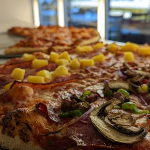 Solid pizza, square Sicilian Pizza and Calzone.