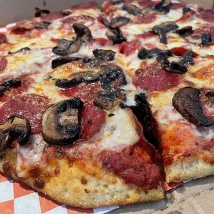 Small Pepperoni and Mushroom Pizza.