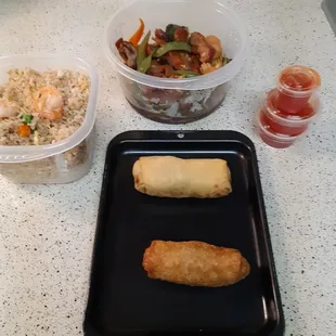 Shrimp Fried Rice, Pork &amp; Shrimp Egg Rolls, Sweet &amp; Sour Sauce and Barbecue Pork with Vegetables.