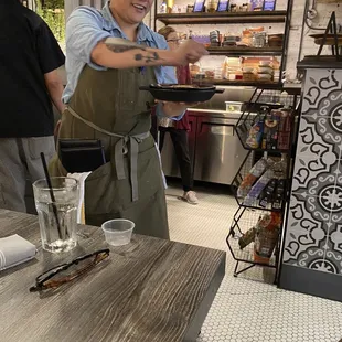 a woman serving food
