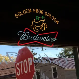 stop sign and neon sign