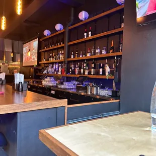 a bar with bottles of alcohol