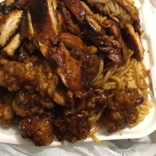 Can't even see the rice underneath all the teriyaki and orange chicken lol (: my type of place