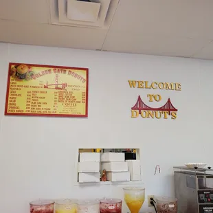 a sign on the wall of a donut shop