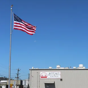  american flag flying in front of building