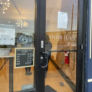 Entrance with store hours