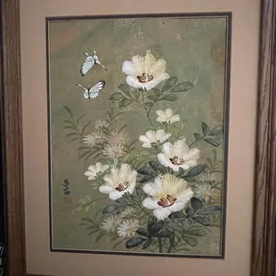 First of two framed and matted paintings