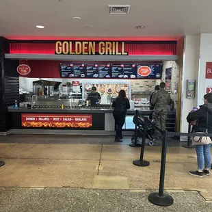 people standing in line at the counter
