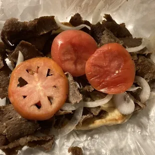 Two wrinkled butt ends of tomato