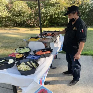 Main course, hamburger fixings, corn, beans, ribs and chicken