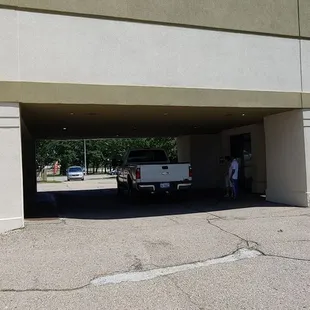a white truck parked in a parking garage