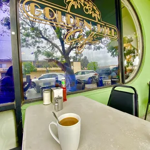 a cup of coffee on a table