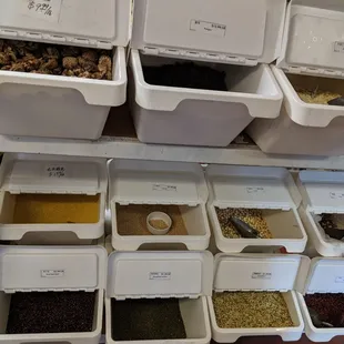 a variety of spices in bins