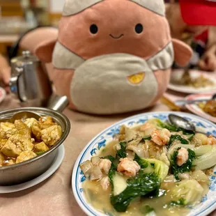 a plate of food and a stuffed animal