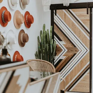 so much work in design was put into every detail in our clothing boutique! this photo also highlights our infamous hat wall.