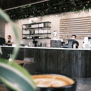 a bari serving a cup of coffee