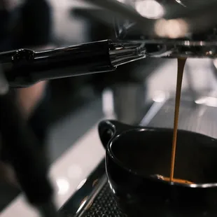 coffee being poured into a cup