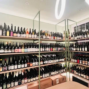 rows of bottles of wine on shelves