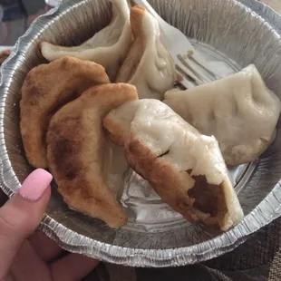 a plate of dumplings and a fork