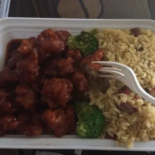 a plate of food with rice and broccoli