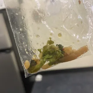 a piece of broccoli in a plastic bag