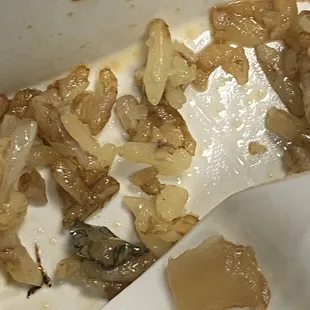 a fork and some food left in a container