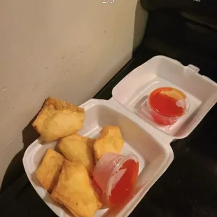 The duck sauce is the red sauce in that lil container really gross and the ragoons are disgusting