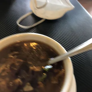 a bowl of soup with a spoon in it