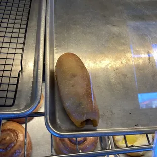 The lone Sausage &amp; Cheddar roll after I got two just like it.  Room temperature which is good with me. Delicious!