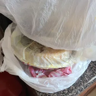 a sandwich wrapped in plastic