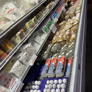 a display of eggs and cheeses