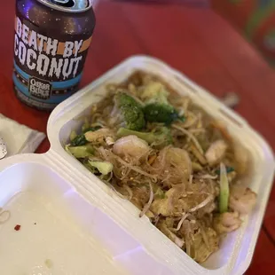 a drink and a container of noodles