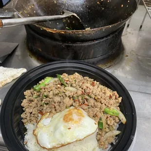 KaPow is a Thai favorite. Ground pork, Thai basil, white and green onions, steamed rice with an egg on top