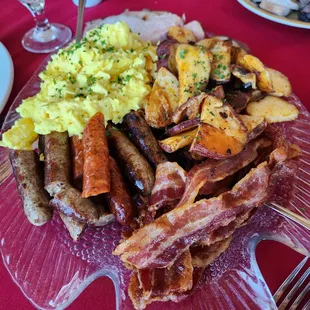 Eggs, bacon, sausage, potatoes family style