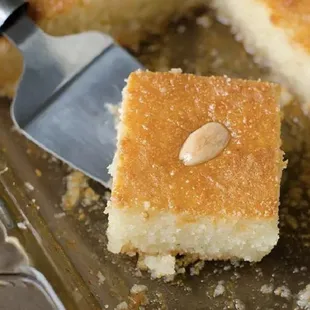 a piece of cake on a plate with a spatula