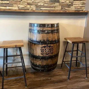 two stools and a wooden barrel