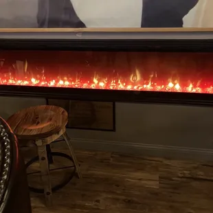a picture of a fireplace with flames