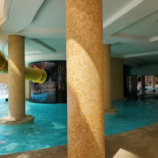a water slide in the middle of the pool