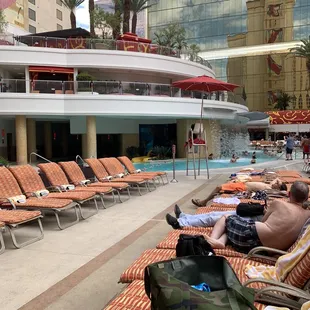 people lounging by the pool