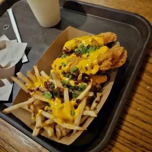 a tray of fries and a glass of milk