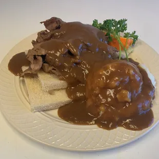 Open Faced hot roasted beef sandwich (Roast is cooked in house) .