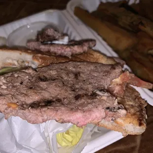 Uncooked meat I paid for and it took A while to get one burger uncooked smh