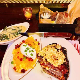 Dry Age Kansas City Strip loaded mashed potatoes and cream spinach