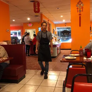 a man walking through a restaurant