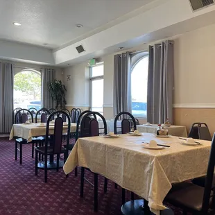 a dining room with tables and chairs