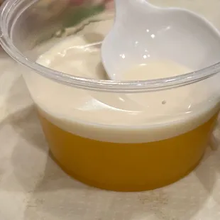 Mango gelatin with evaporated milk on top for dessert